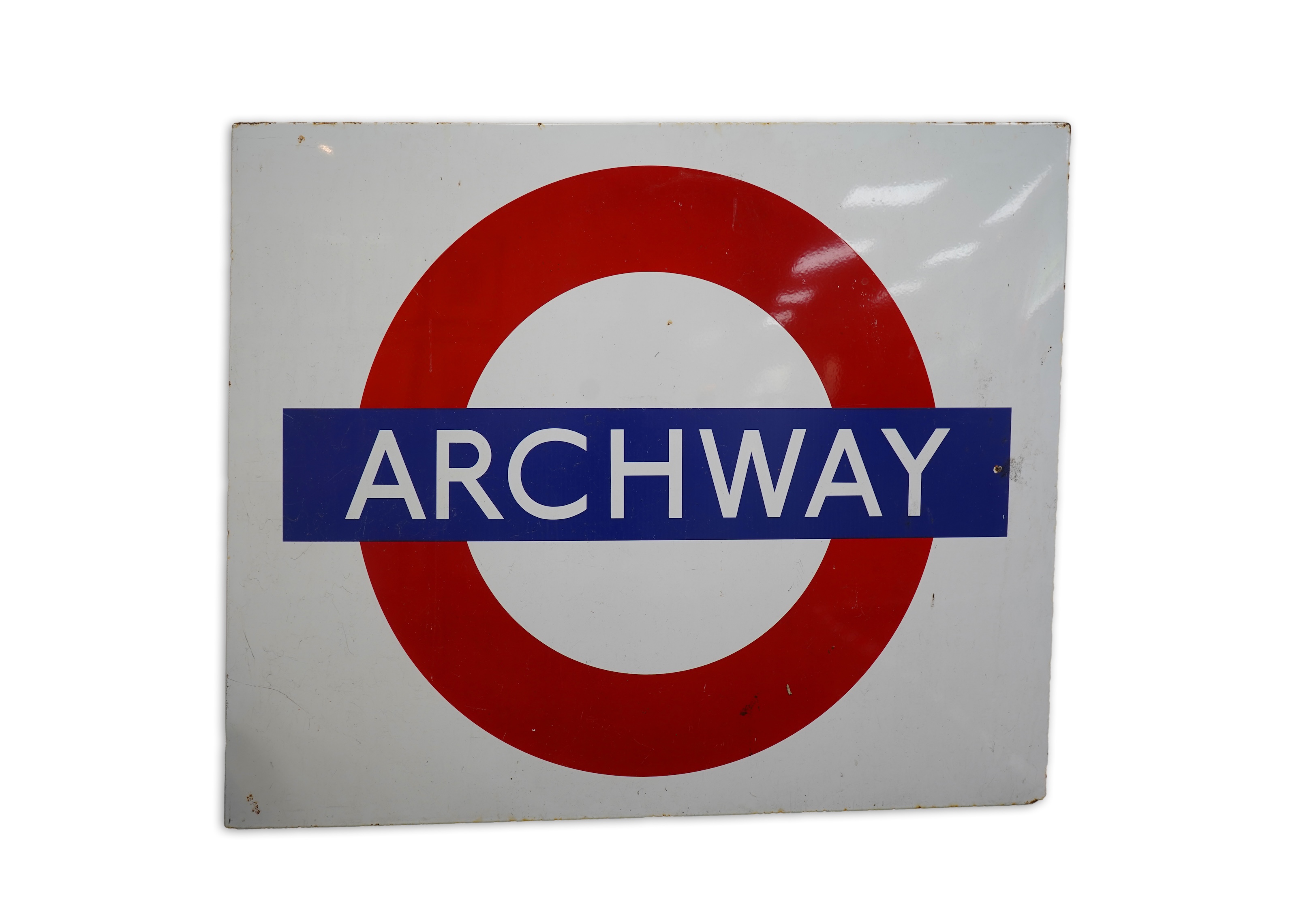 A 1950s/60s London Underground enamel bullseye station sign for Archway, 152.5cm wide, 122cm high, with plied manufacturers sticker for ‘Burnham Signs’ to the reverse